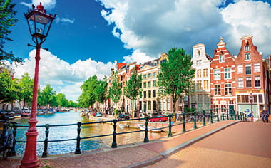 A view down a canal in Amsterdam, Netherlands A view down a canal in Amsterdam, Netherlands